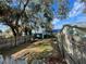 Large backyard with plenty of tree coverage, wooden fences and room to build or relax at 701 54Th S St, Gulfport, FL 33707