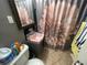Cozy bathroom with unique pink fixtures and tiled floors at 701 54Th S St, Gulfport, FL 33707