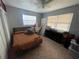 Bedroom with tile flooring, neutral paint, ceiling fan, and natural light from the two windows at 701 54Th S St, Gulfport, FL 33707