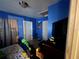 Blue bedroom with playful decor and a twin bed, creating a fun and inviting space at 701 54Th S St, Gulfport, FL 33707