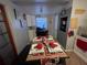 Charming dining room with set table, perfect for hosting intimate gatherings at 701 54Th S St, Gulfport, FL 33707