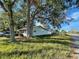Well maintained yard with a single story home featuring a covered walkway at 701 54Th S St, Gulfport, FL 33707