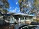 Inviting single-story home with a cozy front porch and well-maintained exterior at 701 54Th S St, Gulfport, FL 33707