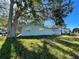 Well-kept home exterior with a view of the grassy yard and surrounding trees at 701 54Th S St, Gulfport, FL 33707