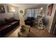 Living room with cozy seating, decorative wreath, and Christmas tree adorned with lights at 701 54Th S St, Gulfport, FL 33707