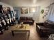 Cozy living room with tile floors, comfy seating, and a decorative bookshelf at 701 54Th S St, Gulfport, FL 33707