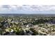 Expansive aerial view of a neighborhood with lush green trees and clear blue skies at 8277 82Nd N Ave, Largo, FL 33777