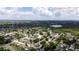 Overhead view of a residential area featuring mature trees, nearby lakes, and well-maintained homes at 8277 82Nd N Ave, Largo, FL 33777