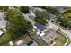 A bird's eye view of the property showing the house, lush trees, fenced in yard and pool at 8277 82Nd N Ave, Largo, FL 33777