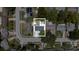 Aerial view showcases the property's layout, including the pool, landscaping, and surrounding neighborhood at 8277 82Nd N Ave, Largo, FL 33777