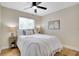 Bright bedroom with a ceiling fan, natural light, and a queen-size bed at 8277 82Nd N Ave, Largo, FL 33777