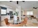 Dining room with a view of the living room and a modern kitchen with stainless steel appliances at 8277 82Nd N Ave, Largo, FL 33777