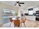 Open floorplan featuring a dining area with a view of the pool and a modern kitchen at 8277 82Nd N Ave, Largo, FL 33777