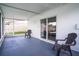 Comfortable lanai with ample space for seating and relaxing, enhanced by a sliding glass door at 8277 82Nd N Ave, Largo, FL 33777