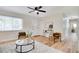 Cozy living room featuring lots of light, stylish decor and wood floors throughout at 8277 82Nd N Ave, Largo, FL 33777