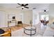 Bright living room featuring an open concept design with stylish decor and wood floors at 8277 82Nd N Ave, Largo, FL 33777
