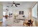 Bright living room featuring an open concept design with stylish decor and modern ceiling fan at 8277 82Nd N Ave, Largo, FL 33777