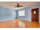 Inviting living room features wood flooring and large front window to provide ample sunlight at 8277 82Nd N Ave, Largo, FL 33777