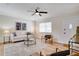 Bright living room with stylish decor, a ceiling fan, and wood floors throughout the house at 8277 82Nd N Ave, Largo, FL 33777