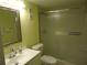Bathroom featuring a vanity with sink and a glass-enclosed shower at 860 Virginia St # 308, Dunedin, FL 34698