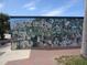 Welcome to Dunedin mural featuring community members and pets at 860 Virginia St # 308, Dunedin, FL 34698