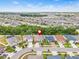 Expansive aerial view of a residential community and neighborhood, home is marked at 10563 Laguna Plains Dr, Riverview, FL 33578