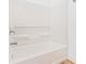 Close-up of white tub and faucet and shower head at 10563 Laguna Plains Dr, Riverview, FL 33578