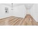 Bright dining room featuring light wood-look floors and contemporary lighting fixture at 10563 Laguna Plains Dr, Riverview, FL 33578