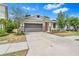 Charming single-Gathering home with a well-manicured front lawn and a two-car garage at 10563 Laguna Plains Dr, Riverview, FL 33578