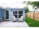 Charming backyard patio with seating area, new fence, and landscaping at 1114 Michigan N Dr, Dunedin, FL 34698