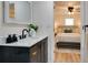 Bathroom vanity features black hardware and is adjacent to the primary bedroom at 1114 Michigan N Dr, Dunedin, FL 34698