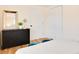 Nicely staged bedroom with modern dresser, full length mirror, and matching décor at 1114 Michigan N Dr, Dunedin, FL 34698