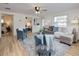 Inviting living room with open layout, showcasing stylish furnishings and connection to bedroom at 1114 Michigan N Dr, Dunedin, FL 34698