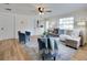 Bright living room with an open concept, comfortable seating, and modern interior design at 1114 Michigan N Dr, Dunedin, FL 34698