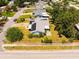 Aerial view of a home with solar panels and a well-maintained yard in a tree-lined neighborhood at 11301 88Th Ave, Seminole, FL 33772