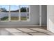 Bedroom with large windows offering abundant natural light and a view of the backyard at 11307 Calgary Cir, Tampa, FL 33624