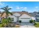 Charming single-story home with a well-manicured lawn and a two-car garage at 11307 Calgary Cir, Tampa, FL 33624