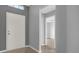 Open foyer with neutral paint, a tiled floor and views to other rooms at 11307 Calgary Cir, Tampa, FL 33624