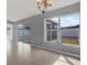 Living area with sliding glass doors and backyard view at 11307 Calgary Cir, Tampa, FL 33624