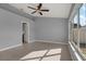 Main bedroom features lots of natural light from bright windows, tile flooring, and gray walls at 11307 Calgary Cir, Tampa, FL 33624
