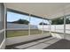 Screened porch overlooking the fenced backyard at 11307 Calgary Cir, Tampa, FL 33624