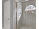 Updated shower with glass door and window at 11307 Calgary Cir, Tampa, FL 33624