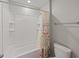 Bathroom with a shower-tub combination, complete with white tile, and modern fixtures at 12607 Flatwood Creek Dr, Gibsonton, FL 33534