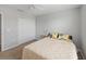 This bedroom offers carpet, closet, and neutral walls creating a serene space at 12607 Flatwood Creek Dr, Gibsonton, FL 33534