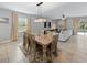 Open concept dining area with view to living room and backyard at 12607 Flatwood Creek Dr, Gibsonton, FL 33534
