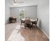 Bright dining area features a round table with seating for four, accentuated by natural light and a cozy workspace at 12607 Flatwood Creek Dr, Gibsonton, FL 33534