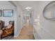 Inviting hallway with neutral tones, tile flooring, and elegant decor at 12607 Flatwood Creek Dr, Gibsonton, FL 33534