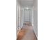 Hallway offers neutral wall color and carpet at 12607 Flatwood Creek Dr, Gibsonton, FL 33534