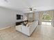 Comfortable living room with a large sectional sofa and view to the pool at 12607 Flatwood Creek Dr, Gibsonton, FL 33534