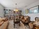 Living room featuring sophisticated furniture, stylish decor, and a large built-in bookcase at 12607 Flatwood Creek Dr, Gibsonton, FL 33534